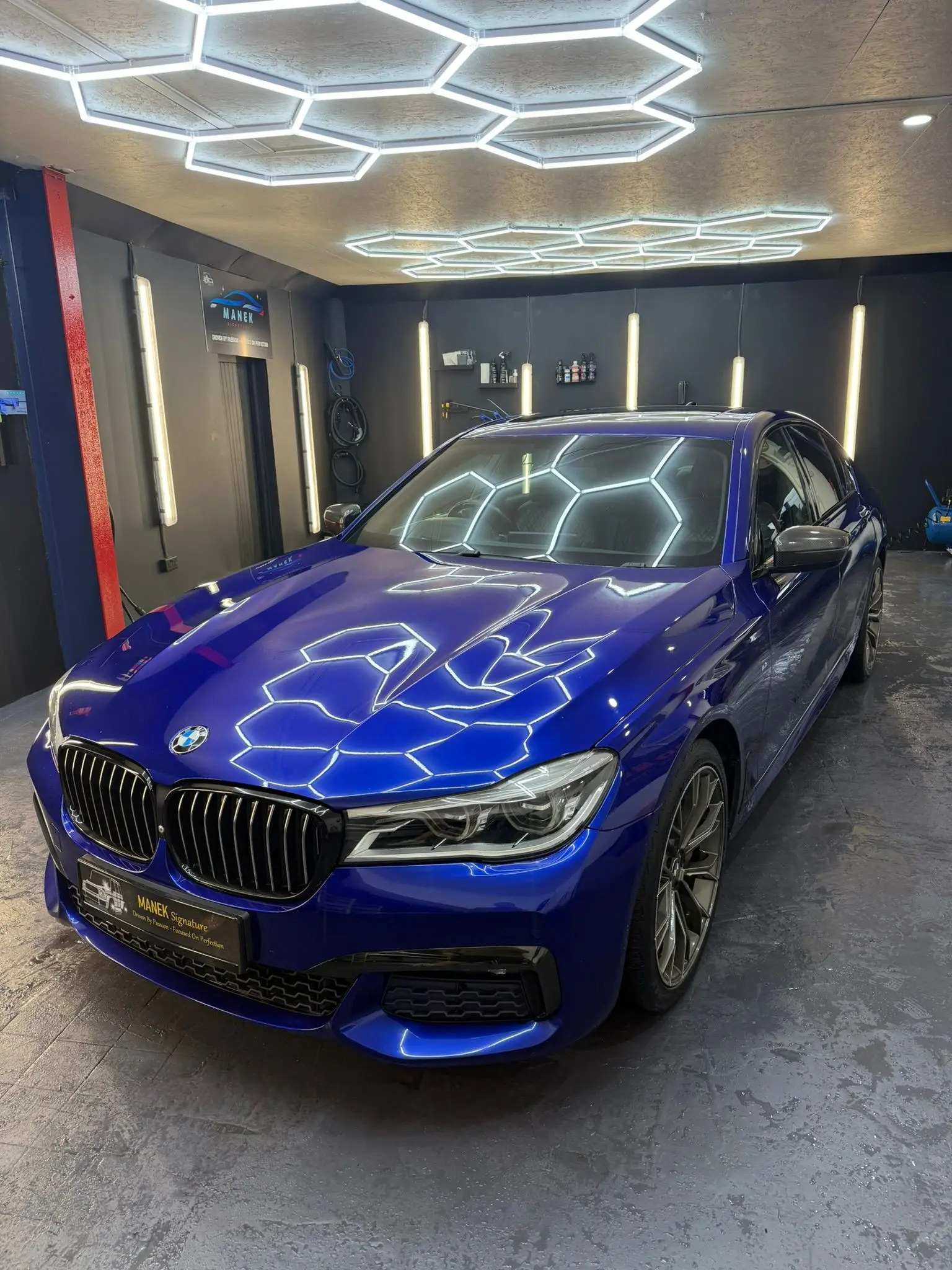 Blue Mercedes professionally detailed by Manek Signature