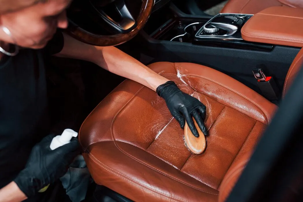 Professional vehicle leather care at Manek Signature