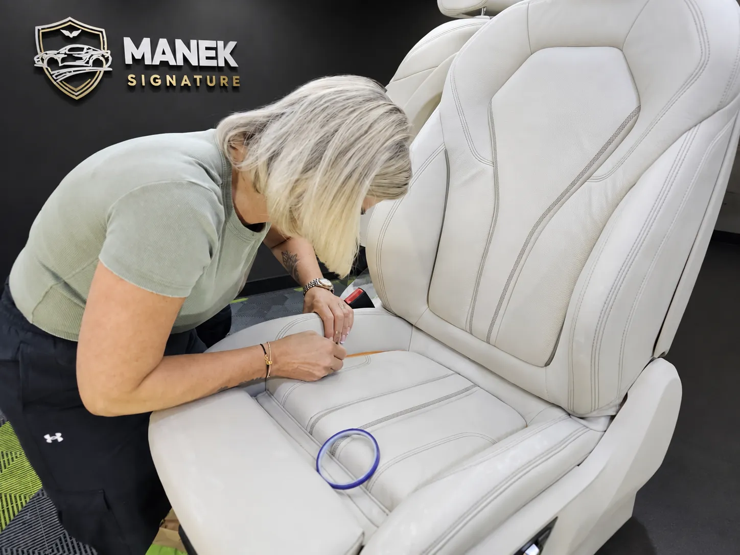 Professional automotive leather restoration by Manek Signature